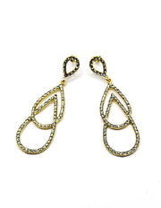 Close up of imitation jewelry uae statement earrings featuring pavé crystal figure-eight frames.