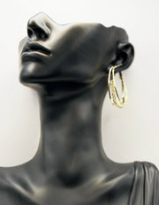 Close up of imitation jewelry uae statement hoops featuring multi-layered crystal bands.