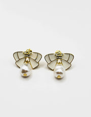 Biya Accessoires artificial jewellery online dubai white enamel ribbon and pearl drop earrings.
