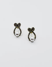 Biya Accessoires gold bow stud earrings with crystal pavé and pearl drop.