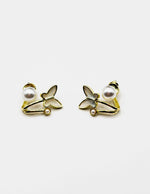 Biya Accessoires gold butterfly earrings with pearlescent wings and twin pearls.