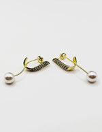 Elegant sparkling crystal and pearl statement earrings for women.