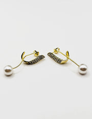 Elegant sparkling crystal and pearl statement earrings for women.