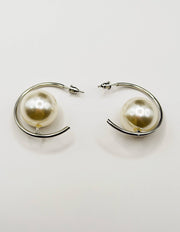 Everyday luxury fashion jewelry gold tone floating pearl studs by Biya Accessoires Dubai.