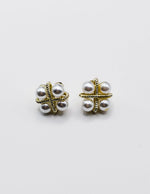 Biya Accessoires gold rope cross stud earrings with four pearls.
