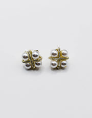 Biya Accessoires gold rope cross stud earrings with four pearls.