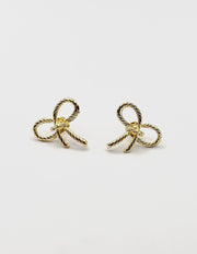 Best fashion jewelry in UAE woven gold ribbon earrings.