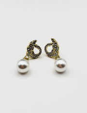 Biya Accessoires pearl drop earrings uae crystal swan design.