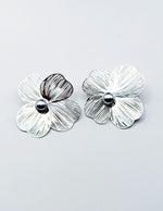 Everyday luxury fashion jewelry statement flower studs by Biya Accessoires Dubai.