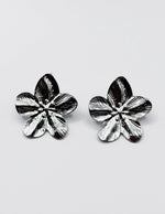 Best fashion jewelry in UAE silver metallic flora statement studs.