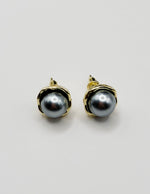 Biya Accessoires two-tone metallic dome stud earrings with gold rim.