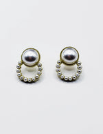 Best fashion jewelry in UAE textured gold and pearl statement studs.