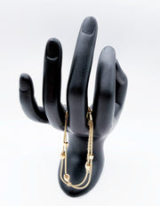 Luxury double strand gold geometric bracelet by Biya Accessoires on modeled wrist.