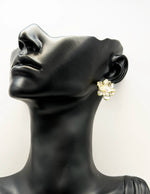 Everyday luxury fashion jewelry gold tone pearl blossom studs by Biya Accessoires Dubai.