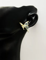 Best fashion jewelry in UAE cream and gold butterfly earrings for women.