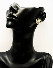 Biya Accessoires gold camellia stud earrings with white enamel and pearls.
