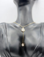 Model wearing an elegant gold lariat drop necklace in the UAE.