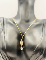 Waterproof gold celestial wing necklace for women in luxury gift box Dubai.