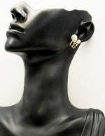 Everyday luxury fashion jewelry gold tone pearl huggies by Biya Accessoires Dubai.