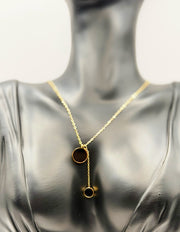 Waterproof non-tarnish artificial gold jewelry with dual black medallion pendant.