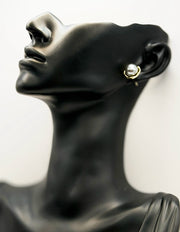 Best fashion jewelry in UAE organic shape gold and silver earrings.