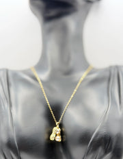 Biya Accessoires 18K gold plated peanut shell necklace with twin pearls and pave crystals.
