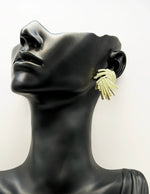 Close-up of premium hypoallergenic imitation jewelry featuring a swirling gold design.