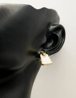 Close-up of premium hypoallergenic imitation jewelry featuring a textured gold frame.