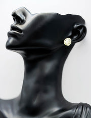 Everyday luxury fashion jewelry gold tone statement studs by Biya Accessoires Dubai.