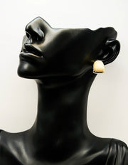 Everyday luxury fashion jewelry gold tone chunky studs by Biya Accessoires Dubai.