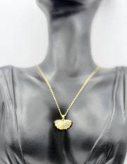 Waterproof non-tarnish artificial gold jewelry resting on a luxury presentation box.