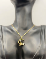 Biya Accessoires 18K gold plated crescent moon and stars pavé necklace.