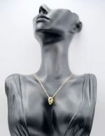Biya Accessoires 18K gold plated interlocking rings necklace with pave crystals.