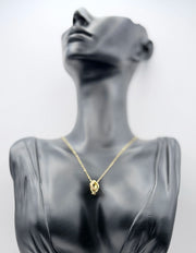 Biya Accessoires 18K gold plated interlocking rings necklace with pave crystals.