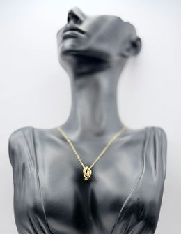 Biya Accessoires 18K gold plated interlocking rings necklace with pave crystals.