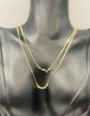 Imitation jewelry featuring a shooting star and crescent moon pendant by Biya Accessoires.
