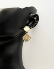 Best imitation jewellery brands in uae gold geometric studs with resin and crystals.