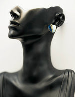 Close up of premium hypoallergenic imitation jewelry featuring a marbled resin design.