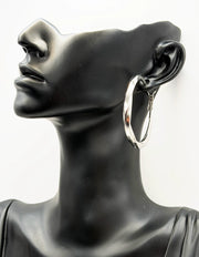 Close up of premium hypoallergenic imitation jewelry featuring a sleek twisted design.