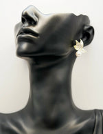Biya Accessoires gold white enamel butterfly and pearl stud earrings.