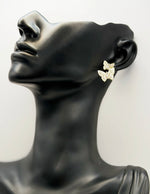 Everyday luxury fashion jewelry gold tone pearl studs by Biya Accessoires Dubai.