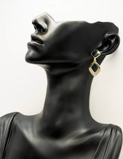 Biya Accessoires gold black enamel and crystal rhombus drop earrings.