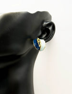 Everyday luxury fashion jewelry gold tone enamel studs by Biya Accessoires Dubai.