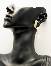 Biya Accessoires gold crystal wave and pearl drop earrings.