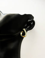 Everyday luxury fashion jewelry gold tone crystal hoops by Biya Accessoires Dubai.