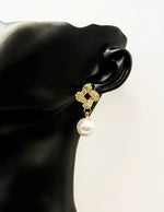 Everyday luxury fashion jewelry gold tone pearl drops by Biya Accessoires Dubai.