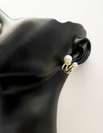 Best fashion jewelry in UAE gold pearl earrings with a floating design.