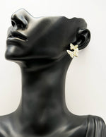 Everyday luxury fashion jewelry gold tone pearl studs by Biya Accessoires Dubai.