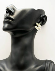 Everyday luxury fashion jewelry gold tone pearl studs by Biya Accessoires Dubai.