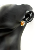 Close-up of premium hypoallergenic imitation jewelry featuring an amber brown stone.